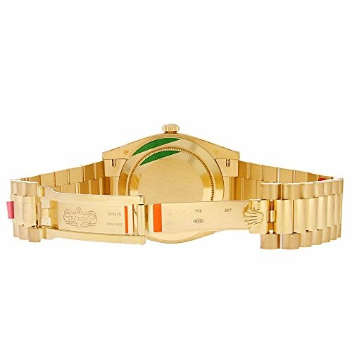 Back view of a gold wristwatch with a metal bracelet