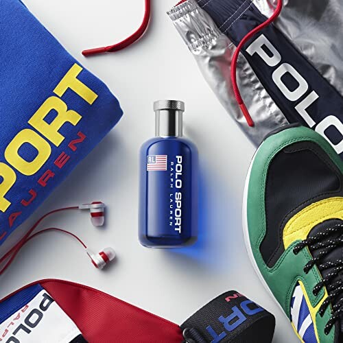 Polo Sport fragrance bottle surrounded by sporty clothing and accessories