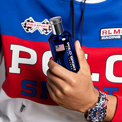 Person holding Polo Sport cologne bottle wearing a Polo Sport shirt and watch